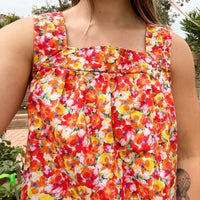 Close up of babydoll tank top in orange red floral print made by Jelena Allen for Mallory Bloom