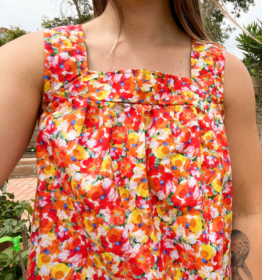 Close up of babydoll tank top in orange red floral print made by Jelena Allen for Mallory Bloom